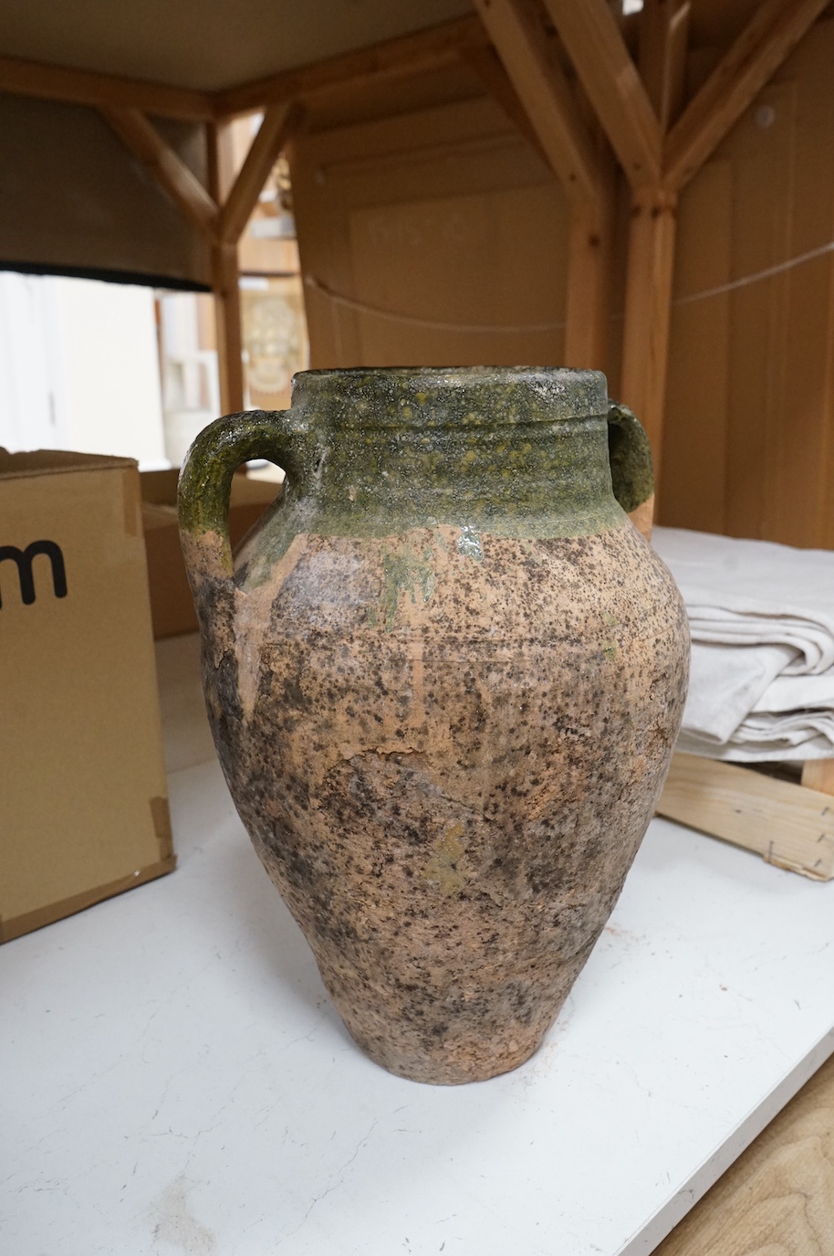 Greek pottery two handled urn, with green glazed stripe, 40cm high.